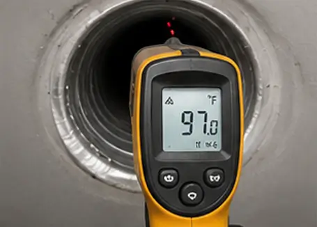 Technician conducting final airflow testing